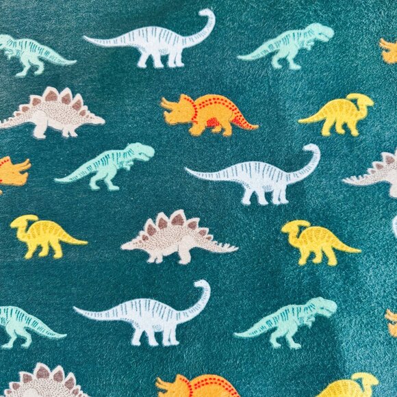 Dinosaurs on Green Flannel Fabric - Picture 1 of 3